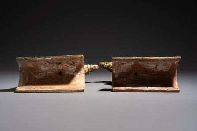 A pair of Chinese sancai-glazed 'Horseriders' roof tiles on wooden stands, Ming