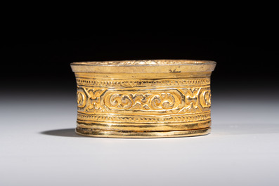 A fine Tibetan gilt-bronze box and cover with repouss&eacute; scroll decoration, 18th C.