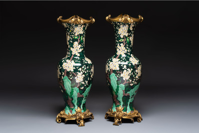 A massive pair of gilt-bronze-mounted famille noire style vases, Samson, Paris, 19th C.