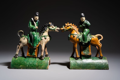 A pair of Chinese sancai-glazed 'Horseriders' roof tiles on wooden stands, Ming