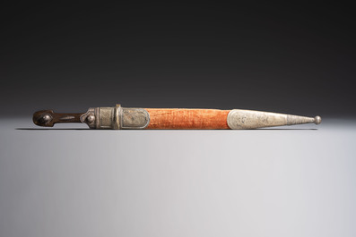 Two Caucasian Kindjal daggers with horn hilts, one with a gilt-iron-mounted leather scabbard and one with a metal-mounted velvet scabbard, 18/19th C