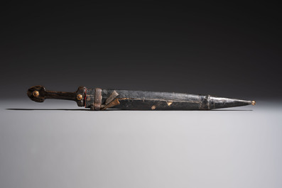 Two Caucasian Kindjal daggers with horn hilts, one with a gilt-iron-mounted leather scabbard and one with a metal-mounted velvet scabbard, 18/19th C