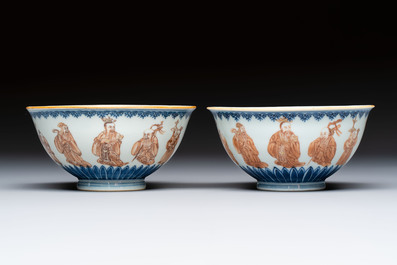 A pair of Chinese blue and white iron-red-decorated 'Three Star Gods' bowls, Qianlong mark and of the period