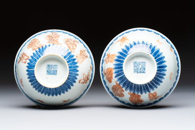 A pair of Chinese blue and white iron-red-decorated 'Three Star Gods' bowls, Qianlong mark and of the period