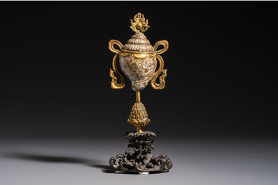 A Chinese parcel-gilt cloisonn&eacute; and bronze 'Conch Shell' Buddhist emblem, 18/19th C.