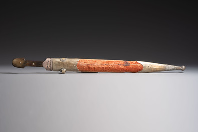 Two Caucasian Kindjal daggers with horn hilts, one with a gilt-iron-mounted leather scabbard and one with a metal-mounted velvet scabbard, 18/19th C
