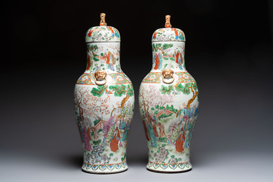 A pair of Chinese famille rose '18 Luohan' vases and covers, 19th C.