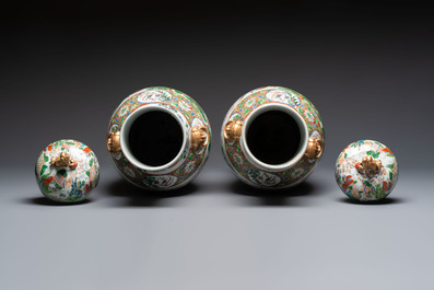 A pair of Chinese famille rose '18 Luohan' vases and covers, 19th C.