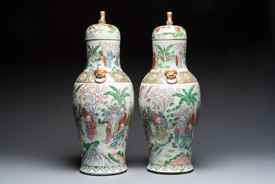 A pair of Chinese famille rose '18 Luohan' vases and covers, 19th C.