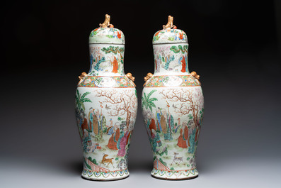 A pair of Chinese famille rose '18 Luohan' vases and covers, 19th C.