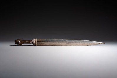 Two Caucasian Kindjal daggers with horn hilts, one with a gilt-iron-mounted leather scabbard and one with a metal-mounted velvet scabbard, 18/19th C