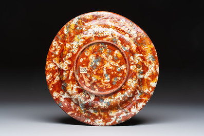 A highly unusual Italian faux marble-splashed armorial pottery dish, 17th C.