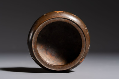 A Chinese or Vietnamese silver-inlaid copper reticulated spherical censer and a silver- and copper-inlaid bronze tripod censer, 19th C.