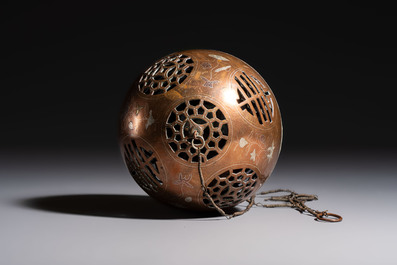 A Chinese or Vietnamese silver-inlaid copper reticulated spherical censer and a silver- and copper-inlaid bronze tripod censer, 19th C.