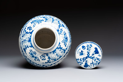 A refined blue and white Dutch Delft jar and cover with a putto on a rock, late 17th C.