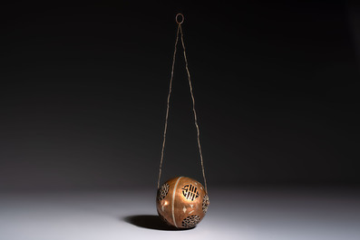A Chinese or Vietnamese silver-inlaid copper reticulated spherical censer and a silver- and copper-inlaid bronze tripod censer, 19th C.