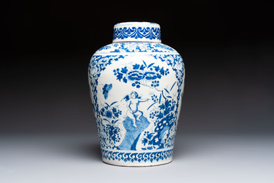 A refined blue and white Dutch Delft jar and cover with a putto on a rock, late 17th C.