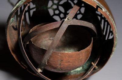 A Chinese or Vietnamese silver-inlaid copper reticulated spherical censer and a silver- and copper-inlaid bronze tripod censer, 19th C.