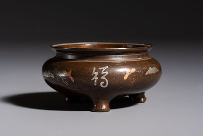 A Chinese or Vietnamese silver-inlaid copper reticulated spherical censer and a silver- and copper-inlaid bronze tripod censer, 19th C.