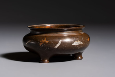 A Chinese or Vietnamese silver-inlaid copper reticulated spherical censer and a silver- and copper-inlaid bronze tripod censer, 19th C.