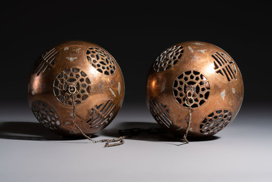 A Chinese or Vietnamese silver-inlaid copper reticulated spherical censer and a silver- and copper-inlaid bronze tripod censer, 19th C.