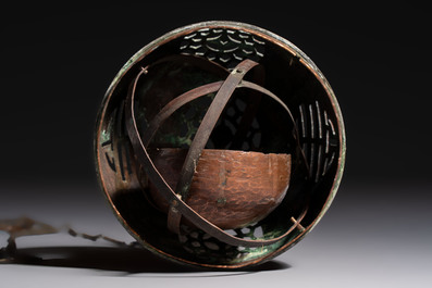 A Chinese or Vietnamese silver-inlaid copper reticulated spherical censer and a silver- and copper-inlaid bronze tripod censer, 19th C.