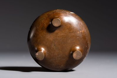 A Chinese or Vietnamese silver-inlaid copper reticulated spherical censer and a silver- and copper-inlaid bronze tripod censer, 19th C.