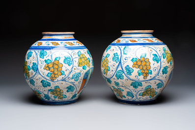 A pair of large polychrome Italian maiolica drug jars with grapevines, Venice, 3rd quarter 16th C.