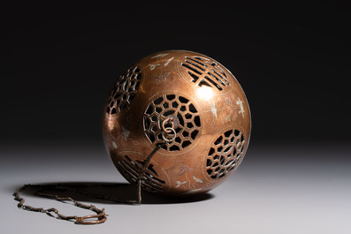 A Chinese or Vietnamese silver-inlaid copper reticulated spherical censer and a silver- and copper-inlaid bronze tripod censer, 19th C.