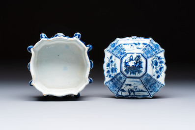 A blue and white Dutch Delft tobacco box and cover with a boy holding tobacco, 18th C.