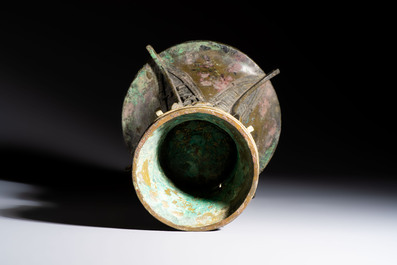 A Chinese archaic bronze wine vessel with Taotie design, Zun 尊, late Shang