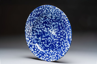 A rare large Nevers white-splashed blue-ground '&agrave; la bougie' dish, France, late 17th C.