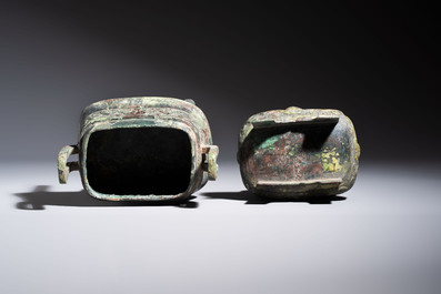 An inscribed Chinese archaic bronze food vessel and cover with double-dragon design, 'Yu Fang Ding 圉方鼎', Western Zhou
