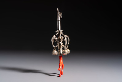 A silver red coral-mounted children's rattle-whistle, 19th C. or earlier