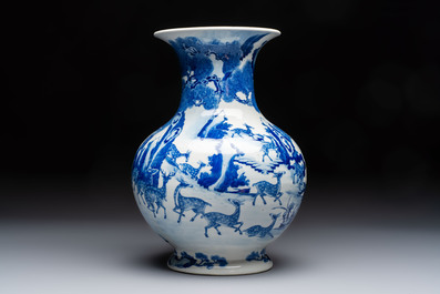 A Chinese blue and white '100 Deers' 'Zun' vase on wooden stand, Kangxi mark, 19th C.