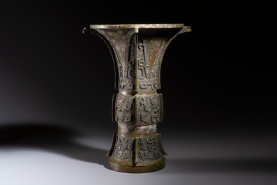 A Chinese archaic bronze wine vessel with Taotie design, Zun 尊, late Shang