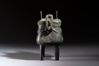 An inscribed Chinese archaic bronze food vessel and cover with double-dragon design, 'Yu Fang Ding 圉方鼎', Western Zhou