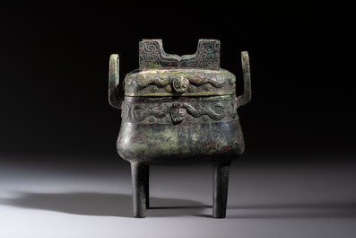 An inscribed Chinese archaic bronze food vessel and cover with double-dragon design, 'Yu Fang Ding 圉方鼎', Western Zhou