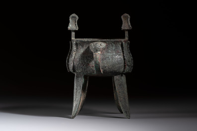 A Chinese archaic bronze wine vessel with owl design, Jia 斝, late Shang