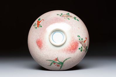 An unusual Chinese famille verte copper-red-ground shallow bowl with floral design, 19th C.