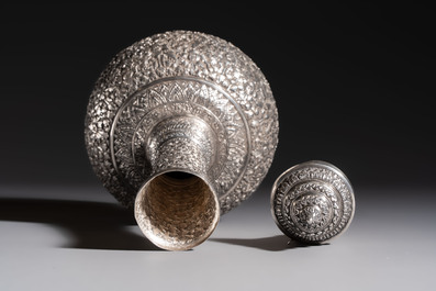 A Thai or Cambodian silver water flask and cover with floral design, late 19/early 20th C.