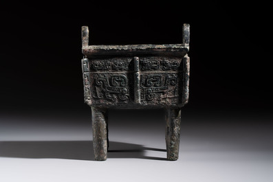 An inscribed Chinese archaic bronze food vessel with Taotie design, Ding 鼎, Western Zhou