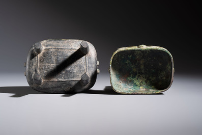 An inscribed Chinese archaic bronze food vessel and cover with double-dragon design, 'Yu Fang Ding 圉方鼎', Western Zhou