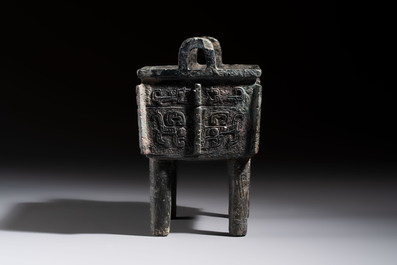 An inscribed Chinese archaic bronze food vessel with Taotie design, Ding 鼎, Western Zhou