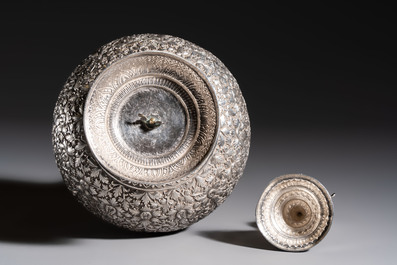 A Thai or Cambodian silver water flask and cover with floral design, late 19/early 20th C.