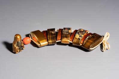 A fine Japanese four-case metal-inlaid lacquer 'Kanshin' inrō by Kōzan with a red coral ojime and a 'Jurojin' netsuke, Kōzan 光山 mark, Edo