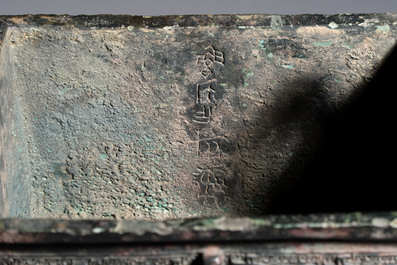 An inscribed Chinese archaic bronze food vessel with Taotie design, Ding 鼎, Western Zhou