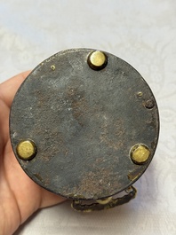 A Korean silver-inlaid iron tripod box with a gilt-bronze bat-shaped handle, Joseon, 18th C.