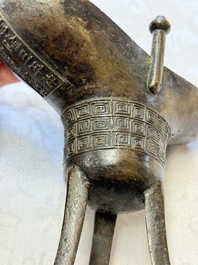 A Chinese archaistic bronze ritual wine vessel, Jue 爵, Qianlong mark, dated 1738