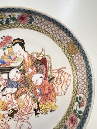 A fine Chinese famille rose eggshell plate with a lady and playing boys, Yongzheng
